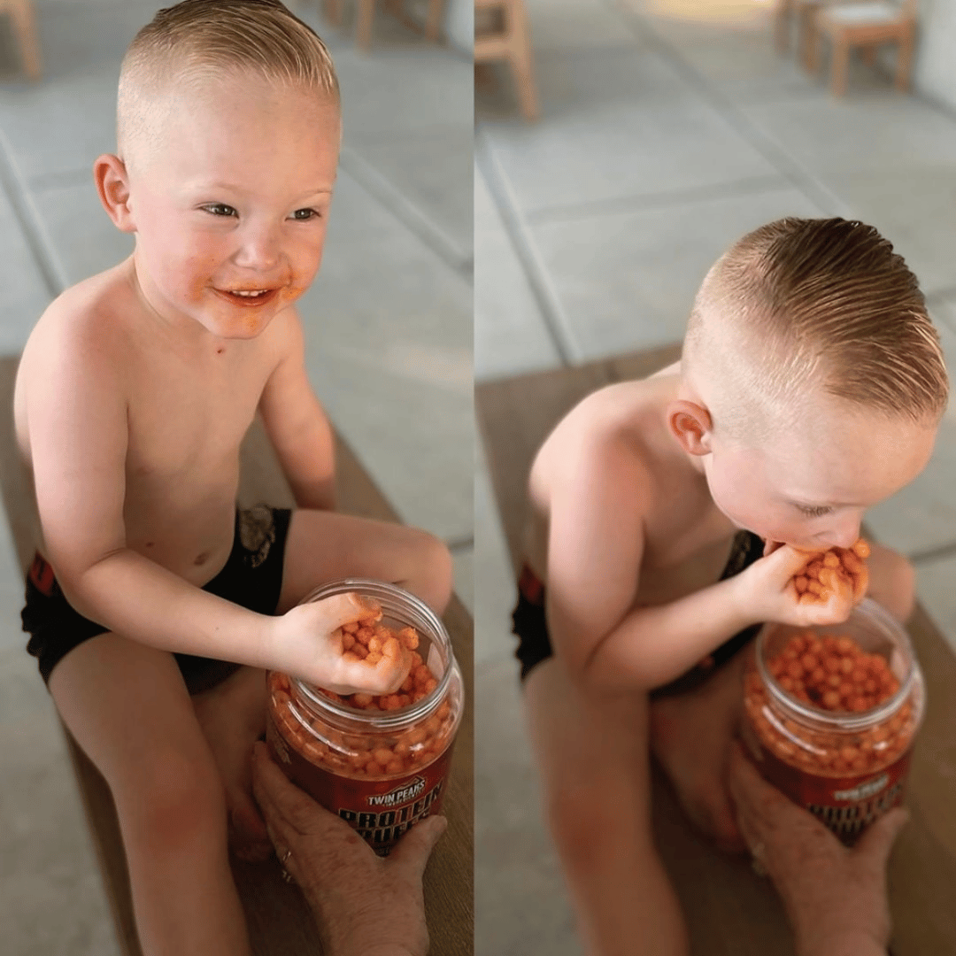 Little Kid Munching On Protein Puffs